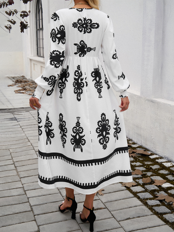 Midi Kjole i Sort og Hvid med Puffede Ærmer og Talje for Kvinder | Velegnet til Hverdagsoutfits